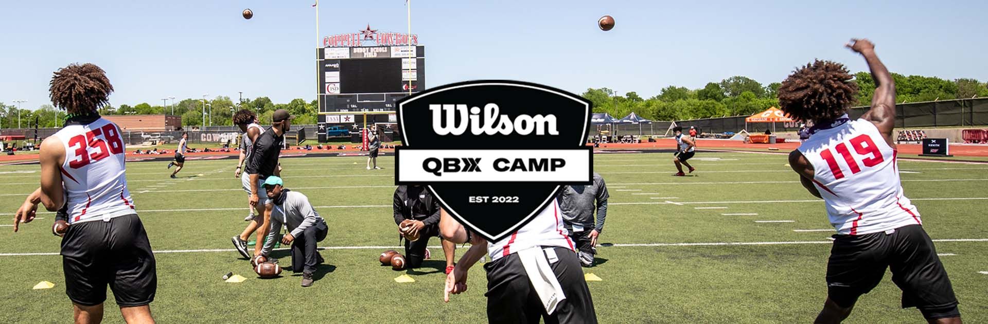 a football field with the qbx camp logo